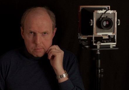 Didier Descartes posing with his large-format bellows camera.